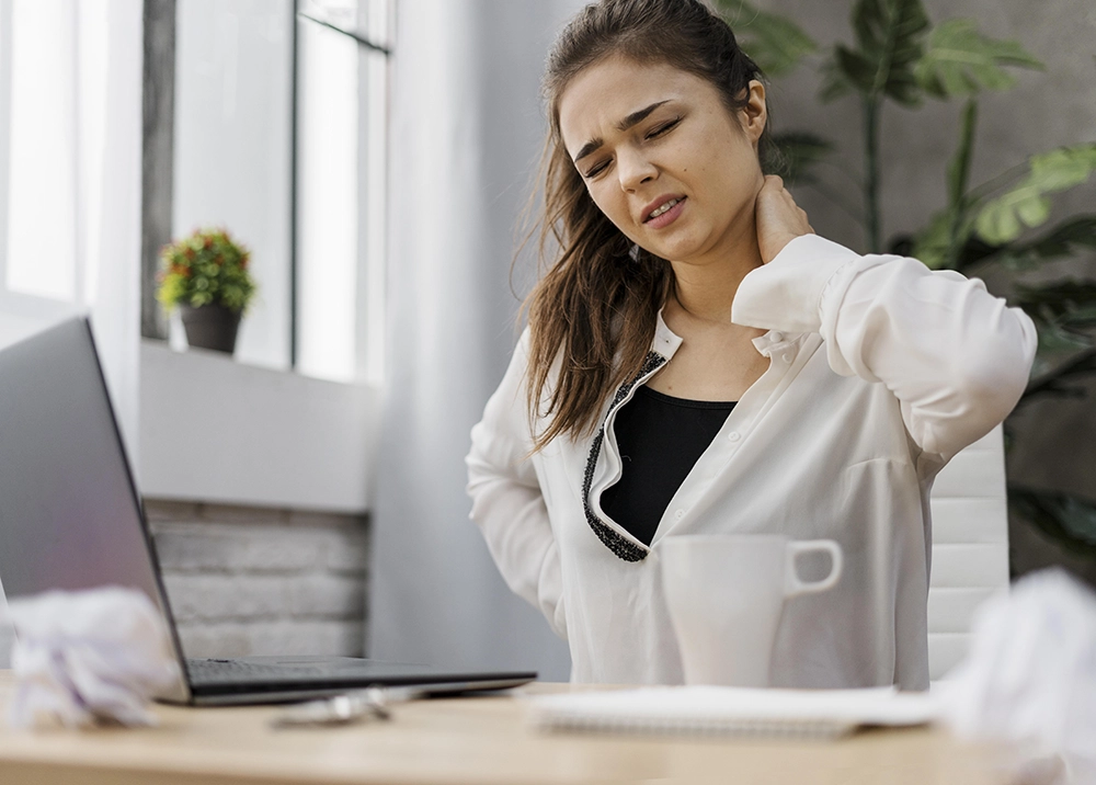 woman-having-neckache-while-working-home